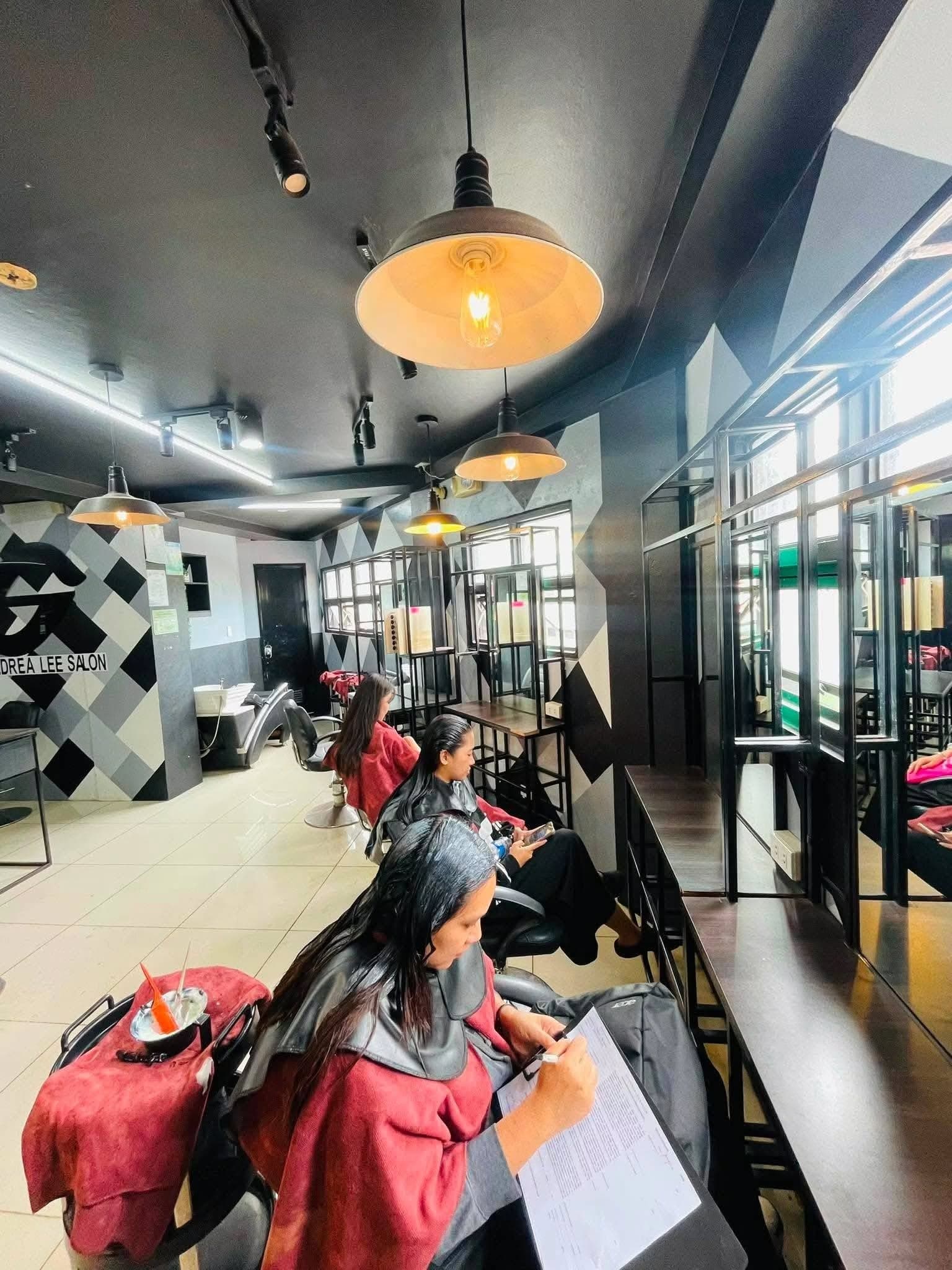 Inside a SandreaLee salon: styling stations, pendant lights and clients in the chair